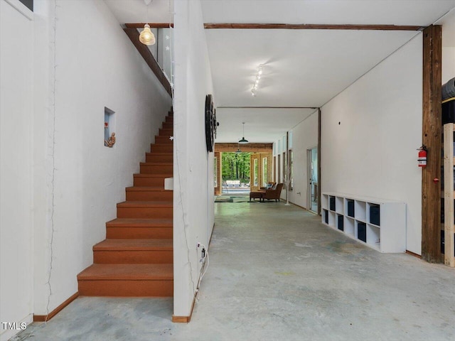 stairway with concrete floors