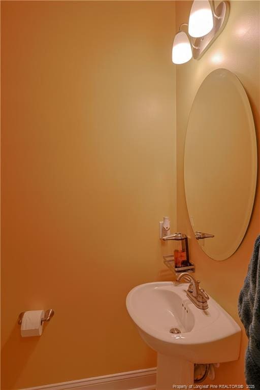 508 Stonebriar Ave, Raeford, NC 28376 - bathroom with baseboards and a sink