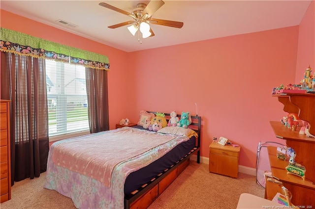 carpeted bedroom featuring a ceiling fan and baseboards