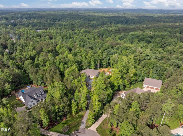 aerial view of property's location with a forest