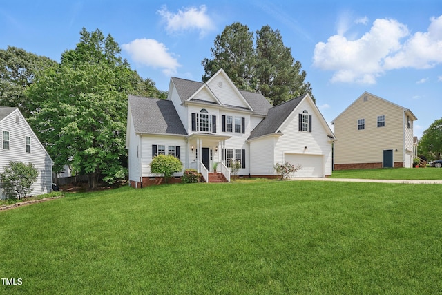 view of front of house featuring a garage, a shingled roof, and a front lawn