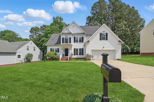 view of front of house with a garage, a front lawn, roof with shingles, and concrete driveway
