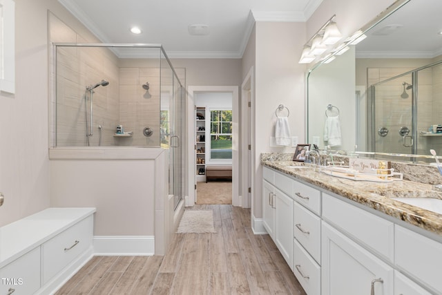 175 Lockamy Ln, Youngsville, NC 27596 - full bath with a shower stall, crown molding, double vanity, wood finished floors, and recessed lighting