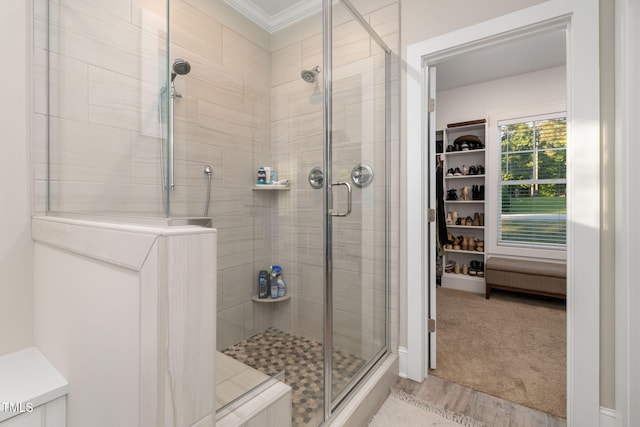175 Lockamy Ln, Youngsville, NC 27596 - bathroom featuring a stall shower, wood finished floors, and crown molding