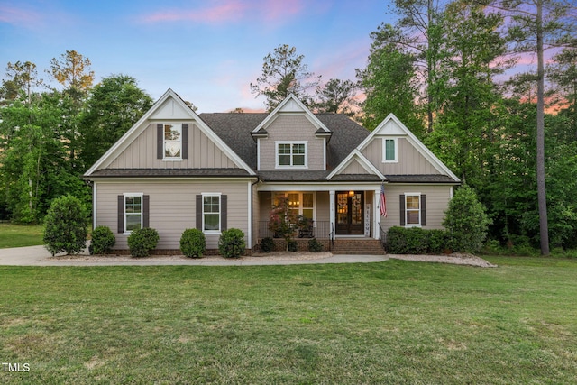 175 Lockamy Ln, Youngsville, NC 27596 - craftsman inspired home with board and batten siding, a porch, a yard, and a shingled roof