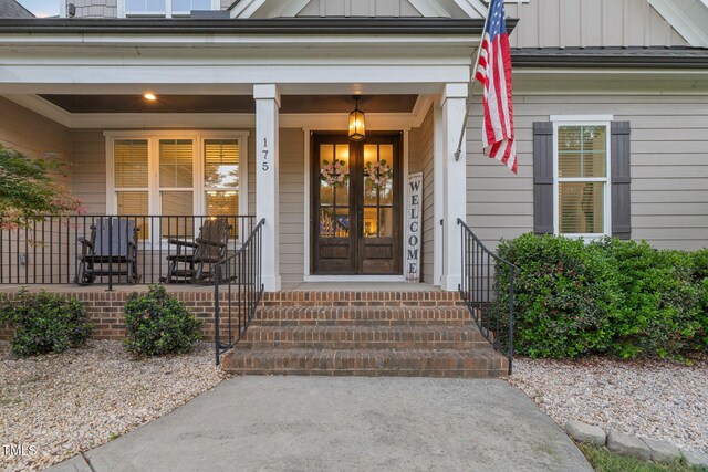 175 Lockamy Ln, Youngsville, NC 27596 - view of exterior entry featuring board and batten siding and a porch