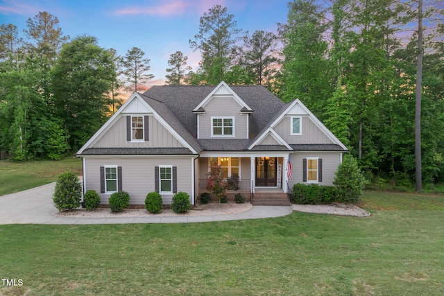 175 Lockamy Ln, Youngsville, NC 27596 - craftsman-style home featuring board and batten siding, a porch, and a front lawn