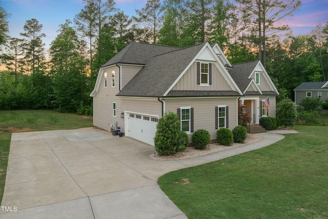 175 Lockamy Ln, Youngsville, NC 27596 - craftsman-style house featuring board and batten siding, a front yard, concrete driveway, and roof with shingles