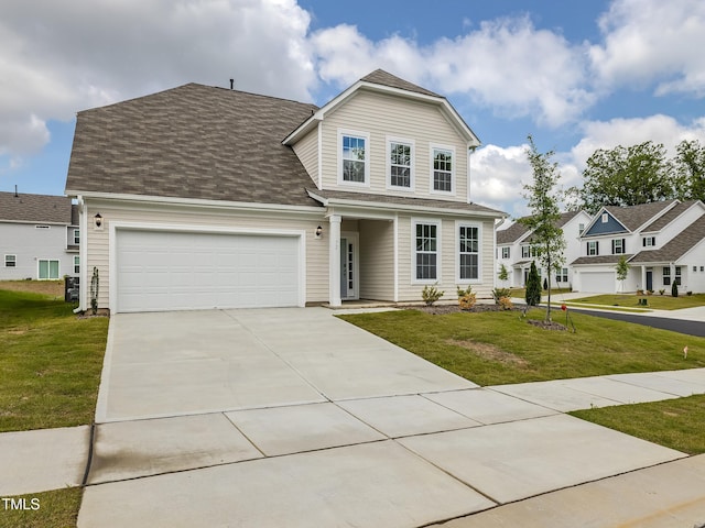 traditional home with a front yard, driveway, an attached garage, and roof with shingles
