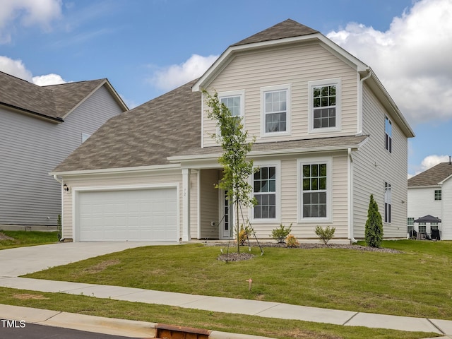 traditional-style house with a front yard, a garage, and concrete driveway