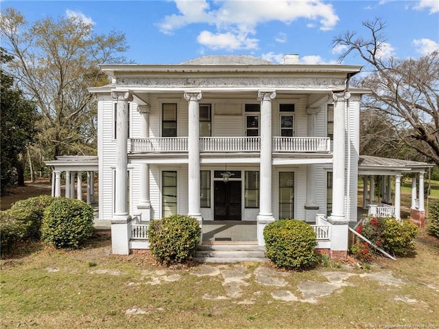 205 N Vance St, Pembroke, NC 28377 - rear view of property with a porch, a chimney, and a balcony