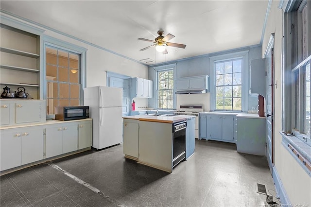 205 N Vance St, Pembroke, NC 28377 - kitchen with ceiling fan, tile patterned floors, a center island, black appliances, and light countertops