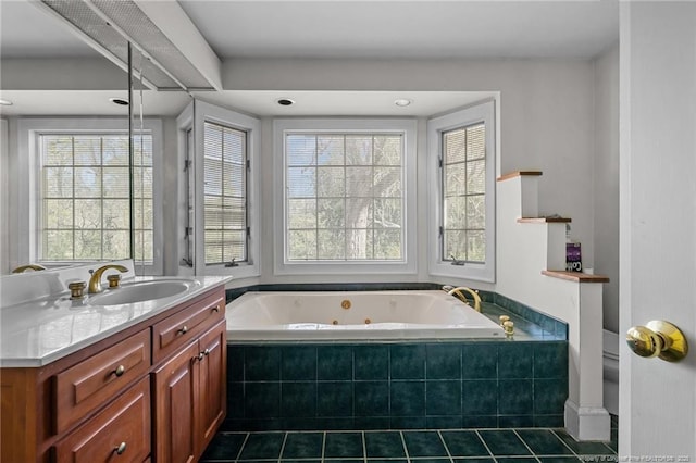 205 N Vance St, Pembroke, NC 28377 - bathroom with tile patterned flooring, a whirlpool tub, and vanity