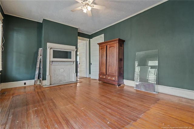 205 N Vance St, Pembroke, NC 28377 - unfurnished living room featuring hardwood / wood-style flooring, crown molding, a ceiling fan, and baseboards