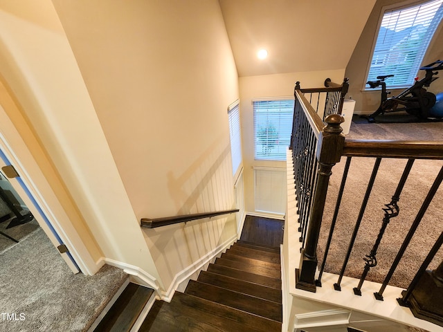428 Parlier Dr, Apex, NC 27523 - stairs featuring carpet floors, vaulted ceiling, hardwood / wood-style flooring, and a wealth of natural light