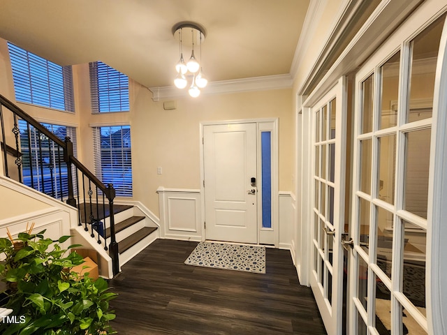 428 Parlier Dr, Apex, NC 27523 - foyer entrance with french doors, crown molding, stairway, a decorative wall, and dark wood-type flooring