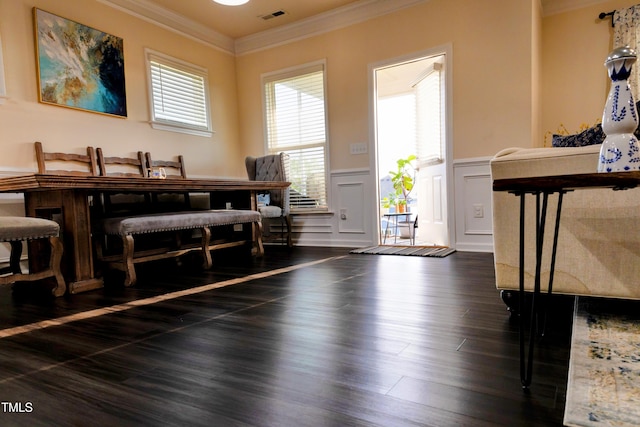 428 Parlier Dr, Apex, NC 27523 - dining area featuring visible vents, crown molding, a wainscoted wall, a decorative wall, and dark wood-type flooring