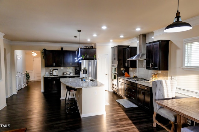 428 Parlier Dr, Apex, NC 27523 - kitchen featuring wall chimney range hood, crown molding, tasteful backsplash, a sink, and stainless steel appliances