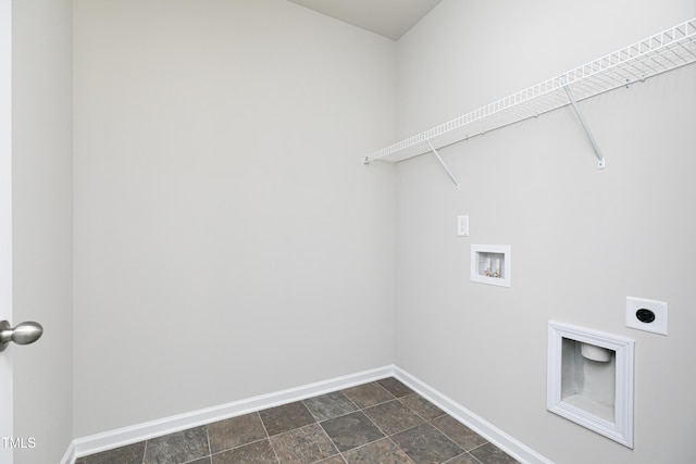 laundry area with hookup for a washing machine, laundry area, electric dryer hookup, stone finish floor, and baseboards