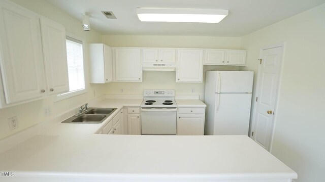 4024 Claret Ln, Morrisville, NC 27560 - kitchen with a peninsula, white appliances, light countertops, under cabinet range hood, and a sink