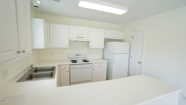 4024 Claret Ln, Morrisville, NC 27560 - kitchen featuring a sink, white appliances, light countertops, a peninsula, and under cabinet range hood