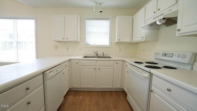 4024 Claret Ln, Morrisville, NC 27560 - kitchen featuring white cabinets, a sink, white appliances, wood finished floors, and under cabinet range hood