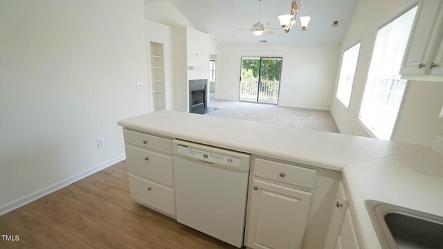 4024 Claret Ln, Morrisville, NC 27560 - kitchen featuring an inviting chandelier, baseboards, light countertops, a fireplace with flush hearth, and dishwasher