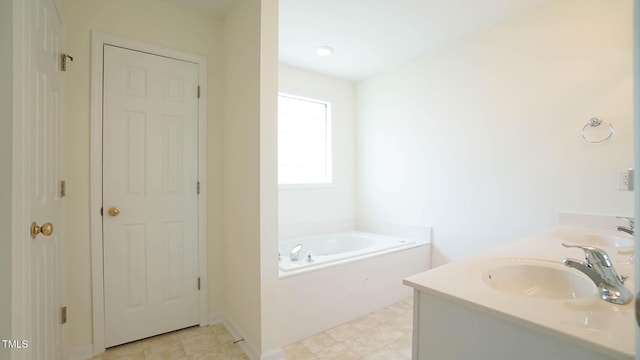 4024 Claret Ln, Morrisville, NC 27560 - bathroom featuring double vanity, a sink, and a bath