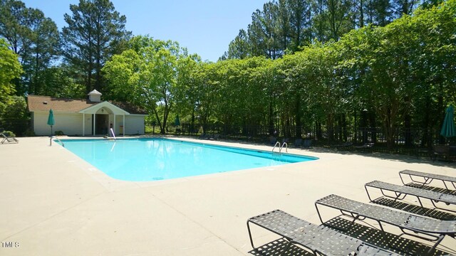 4024 Claret Ln, Morrisville, NC 27560 - pool with fence and a patio