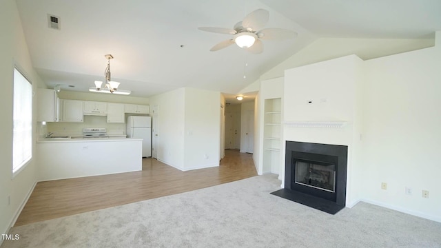 4024 Claret Ln, Morrisville, NC 27560 - unfurnished living room featuring light carpet, a sink, baseboards, vaulted ceiling, and visible vents
