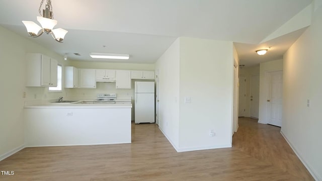 4024 Claret Ln, Morrisville, NC 27560 - kitchen with a sink, baseboards, a peninsula, and white appliances