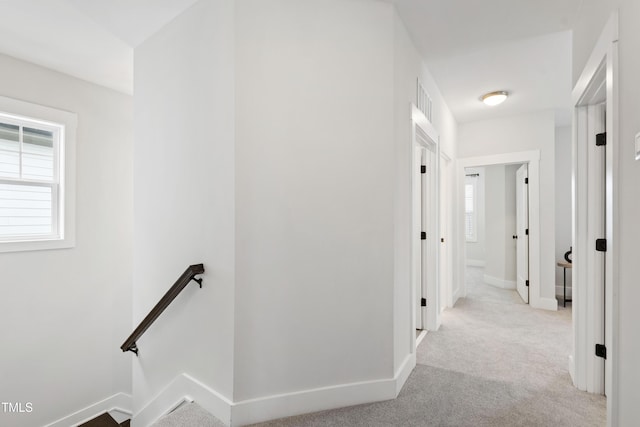 248 Daniel Ridge Rd, Wendell, NC 27591 - hallway with an upstairs landing, plenty of natural light, carpet flooring, and baseboards