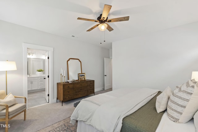 248 Daniel Ridge Rd, Wendell, NC 27591 - bedroom featuring light colored carpet, baseboards, ceiling fan, and connected bathroom