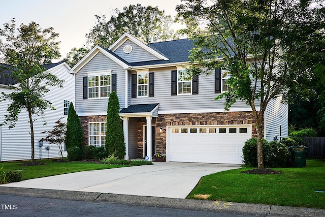 5031 Mckittrick Ln, Durham, NC 27712 - traditional home featuring stone siding, driveway, and a garage