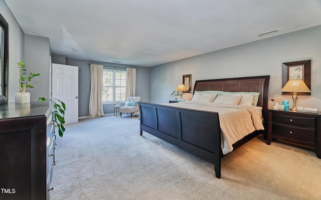5031 Mckittrick Ln, Durham, NC 27712 - bedroom with light colored carpet and baseboards