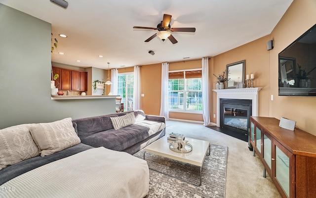5031 Mckittrick Ln, Durham, NC 27712 - living room with ceiling fan, light carpet, a fireplace with flush hearth, and recessed lighting