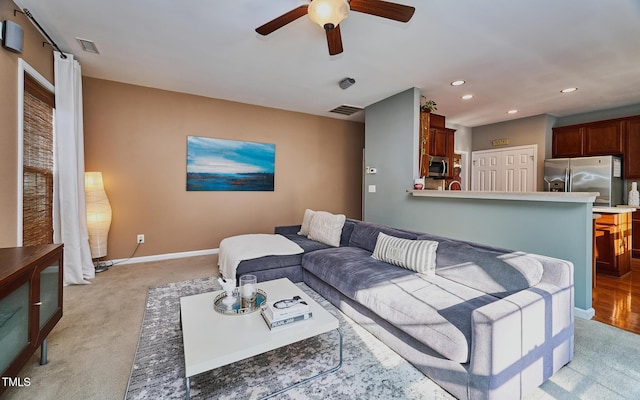 5031 Mckittrick Ln, Durham, NC 27712 - living room with light carpet, a ceiling fan, and recessed lighting