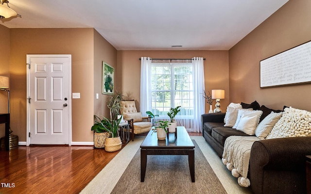 5031 Mckittrick Ln, Durham, NC 27712 - living room featuring wood finished floors and baseboards