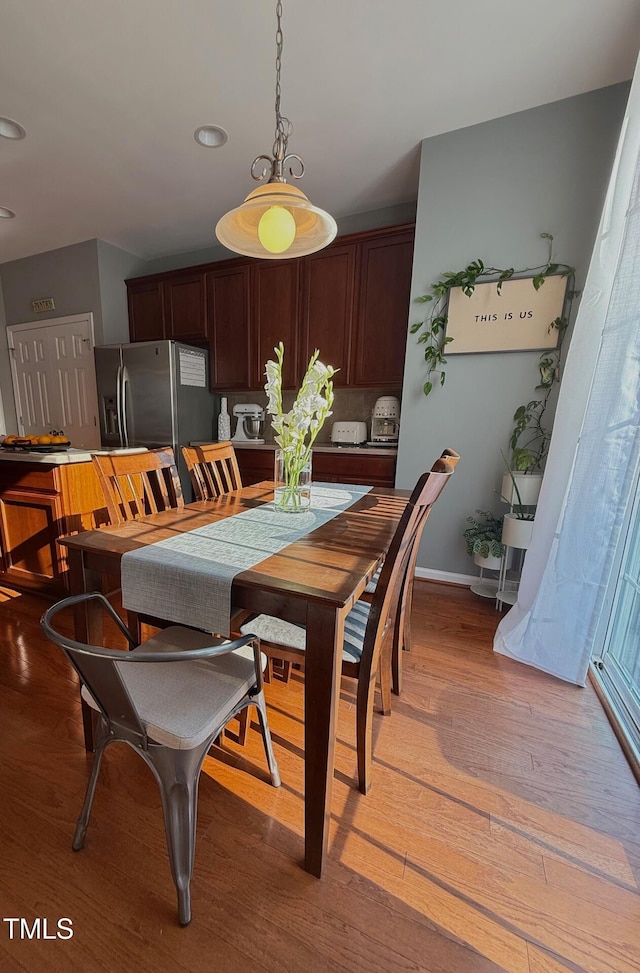 5031 Mckittrick Ln, Durham, NC 27712 - dining space featuring light wood finished floors and baseboards