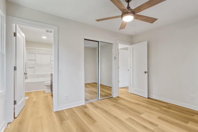 2311 Wintergreen Pl, Durham, NC 27707 - unfurnished bedroom with baseboards, ensuite bathroom, light wood finished floors, and a closet