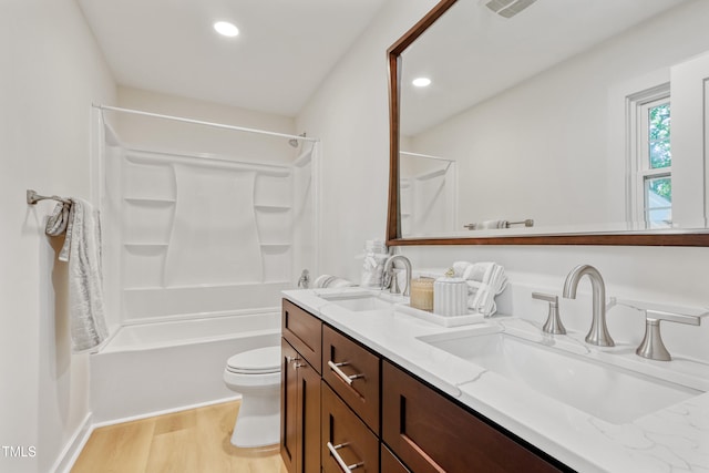 2311 Wintergreen Pl, Durham, NC 27707 - bathroom with a sink, double vanity, recessed lighting, and wood finished floors