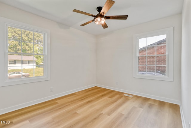 2311 Wintergreen Pl, Durham, NC 27707 - spare room featuring light wood-style floors, baseboards, a ceiling fan, and visible vents