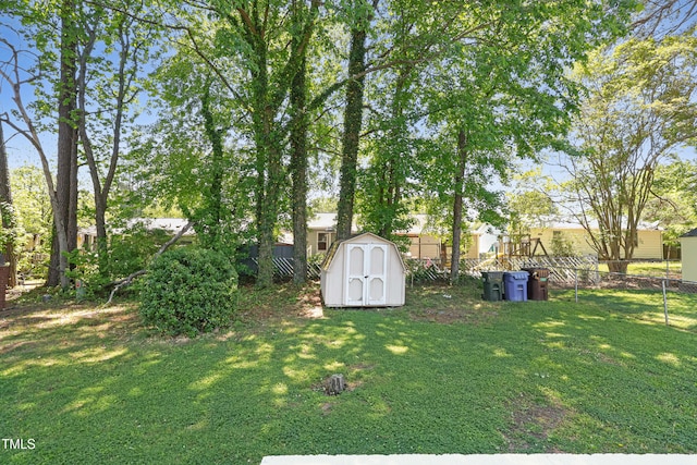 2311 Wintergreen Pl, Durham, NC 27707 - view of yard with fence, a storage unit, and an outdoor structure