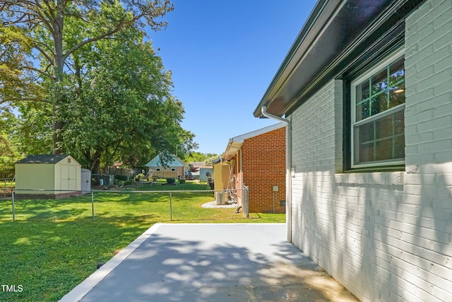 2311 Wintergreen Pl, Durham, NC 27707 - view of yard with fence, a patio, an outdoor structure, and a shed