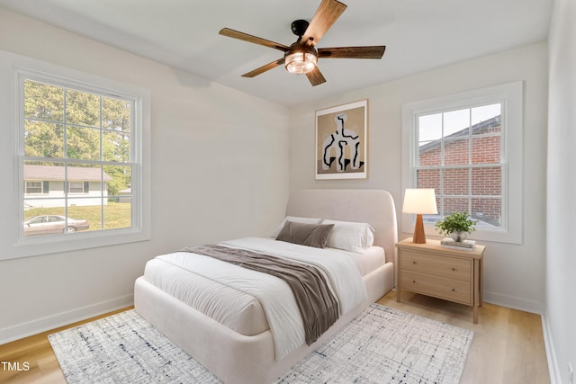 2311 Wintergreen Pl, Durham, NC 27707 - bedroom featuring baseboards, ceiling fan, and light wood finished floors