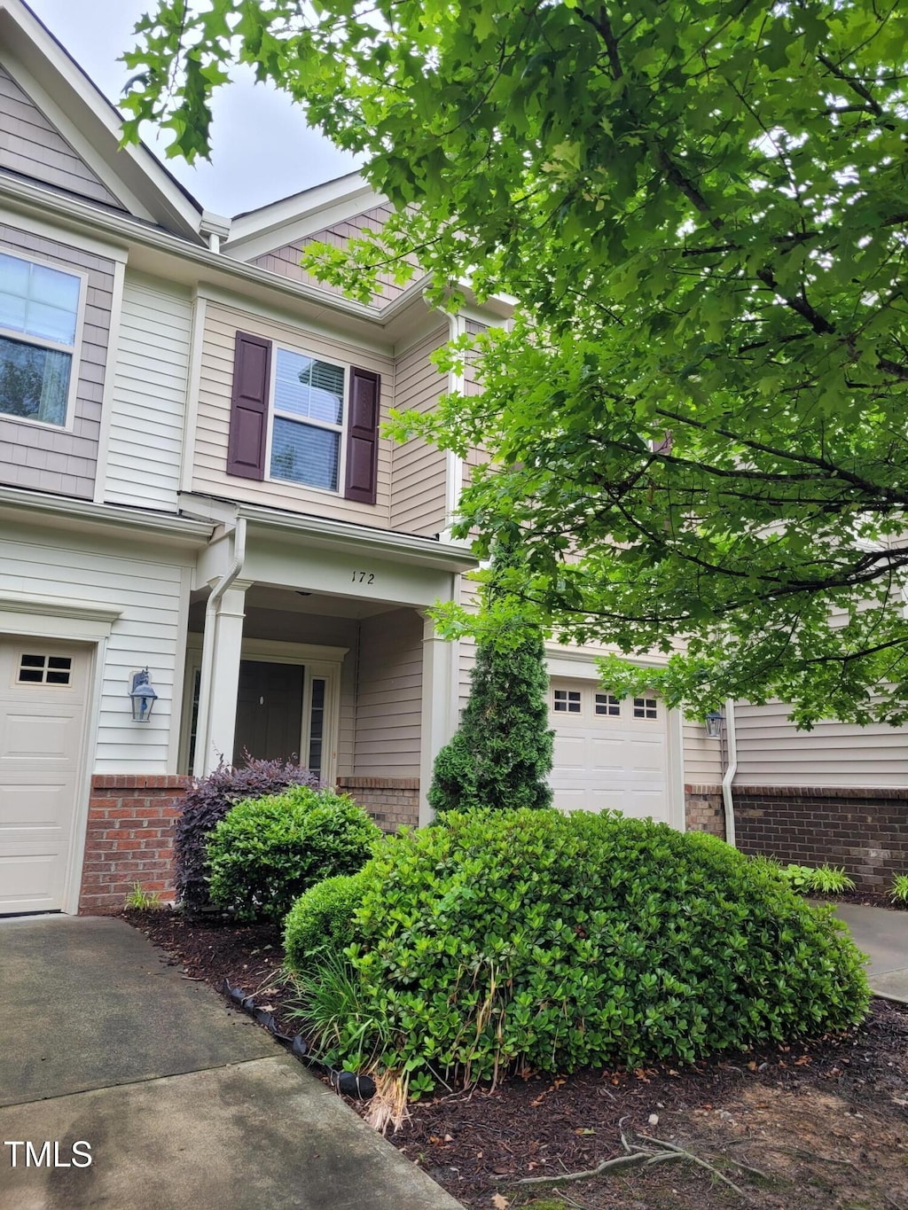 view of front of home featuring brick siding