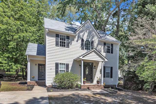 view of front of home with roof with shingles