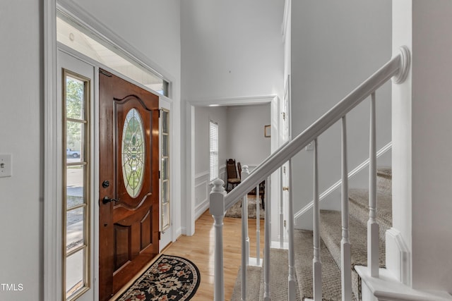 entrance foyer featuring light wood-style floors and stairway