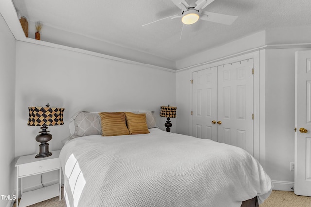 bedroom featuring a closet, a ceiling fan, and baseboards