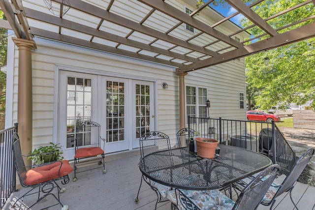 wooden terrace with a pergola, outdoor dining space, french doors, and central air condition unit